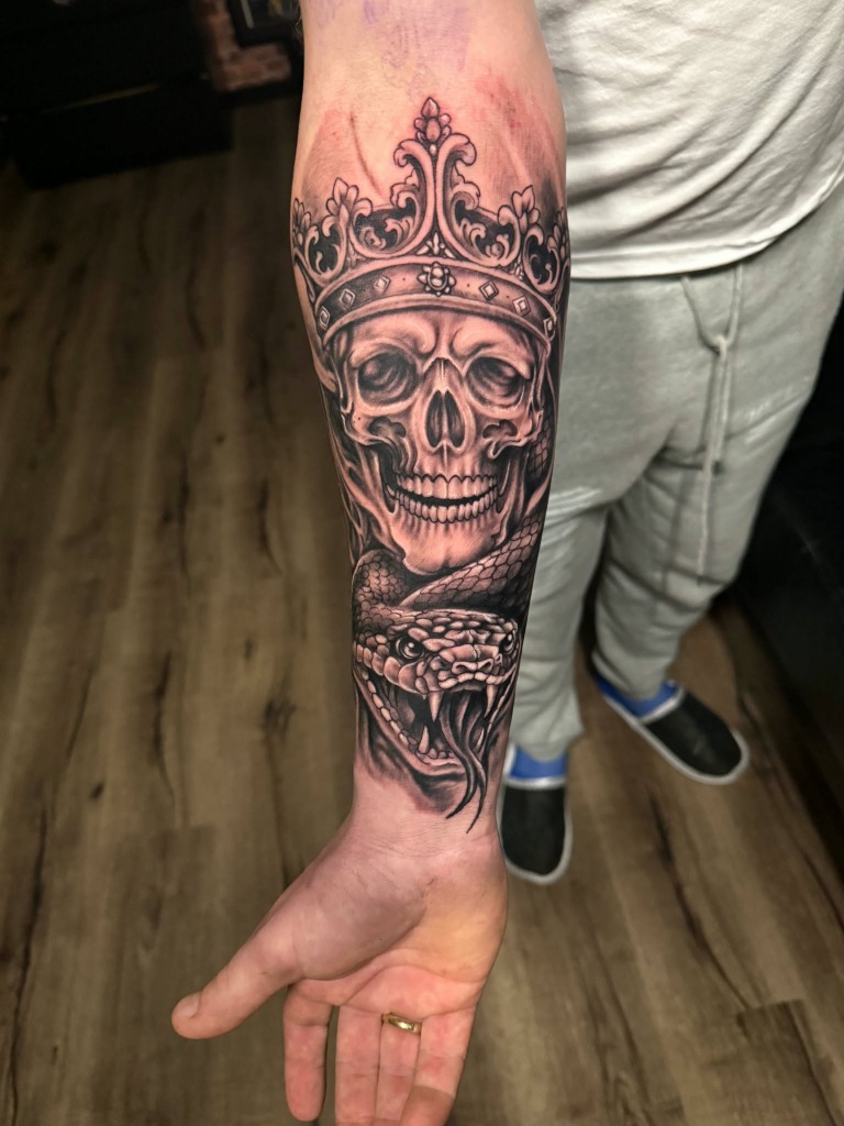 Forearm Crowned King Skull and Snake Realism Tattoo
